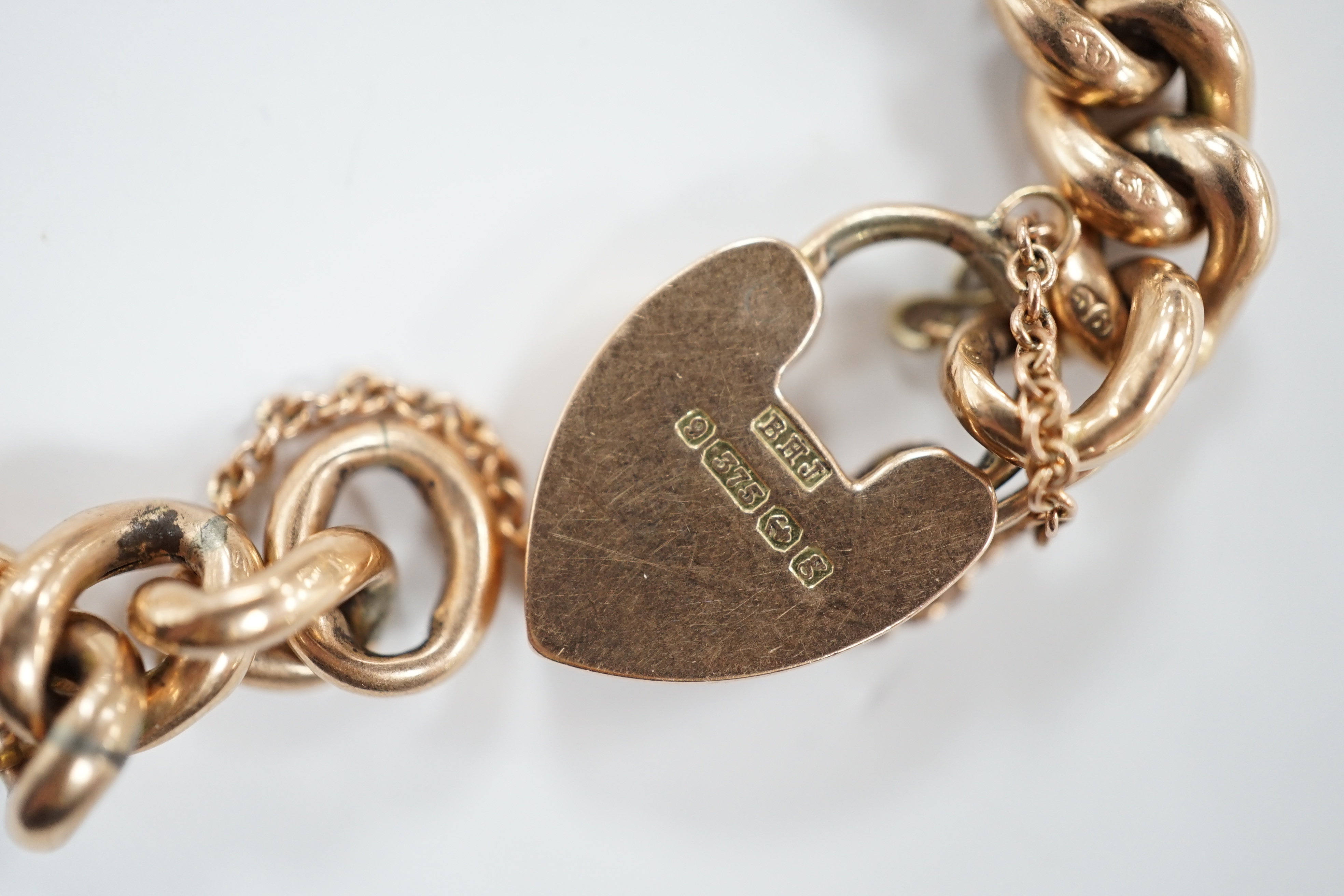 An Edwardian 9ct gold curb link bracelet, with heart shaped padlock clasp, 18cm